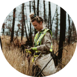 woman performing forest restoration work in the field